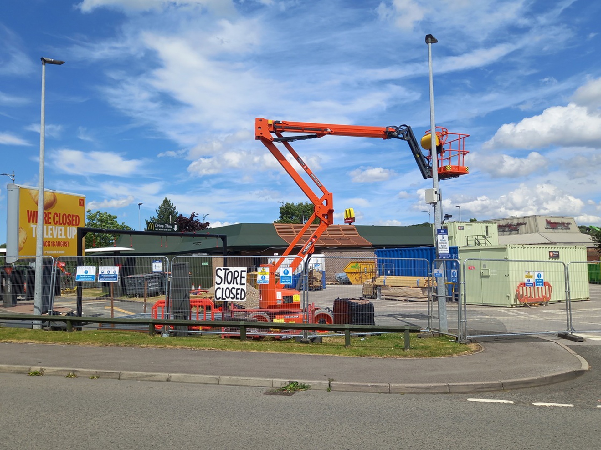 Cherry Picker Locked Behind Fence On Closed Site
