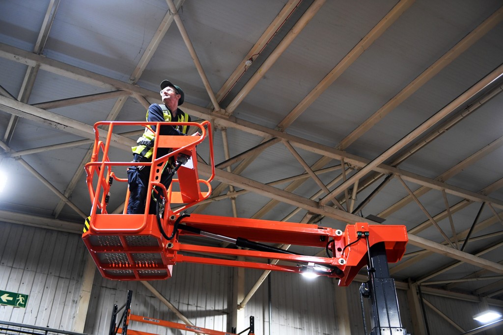 Operator working safely at height on a cherry picker