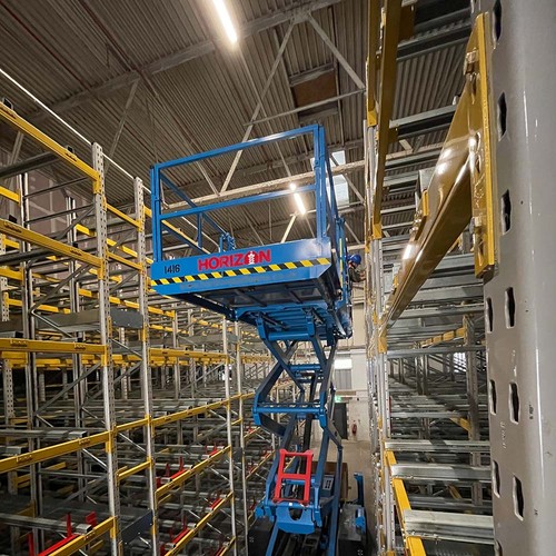 a Horizon scissor lift being used in a racking installation project.